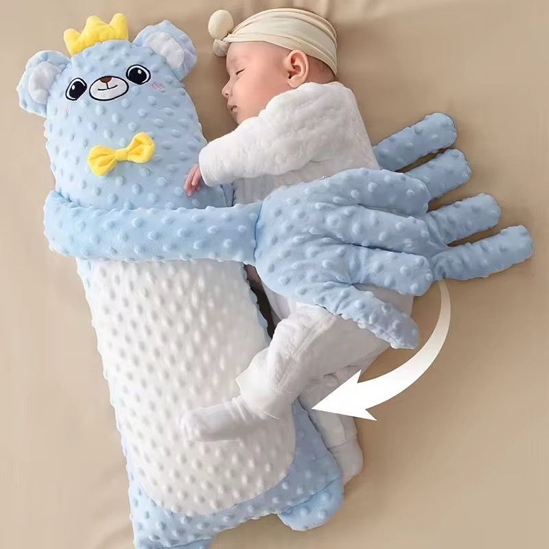 Juguete para dormir imita brazos de mama